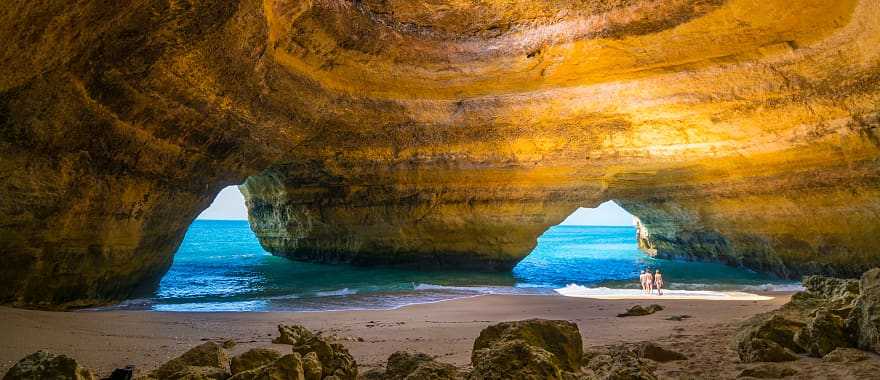 Family exploring the Benagil Caves in Algarve, Portugal