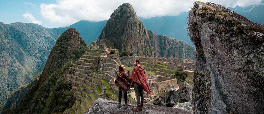 Couple at the great Inca city of Machu Picchu in Peru