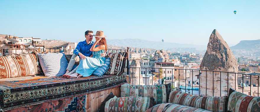 Couple in Cappadocia at sunrise in Turkey.