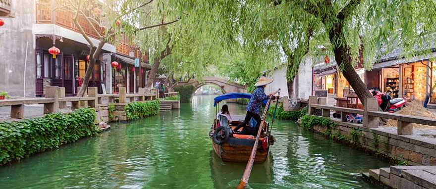 Gondola runs on the canals near Shanghai in China. Gondola runs on the canals near Shanghai in China.