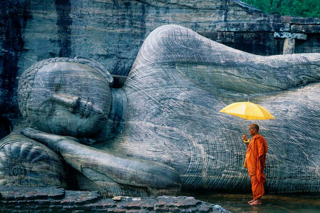 Buddhist Monk at The Gal Vihara in Polonnaruwa, Sri Lanka.