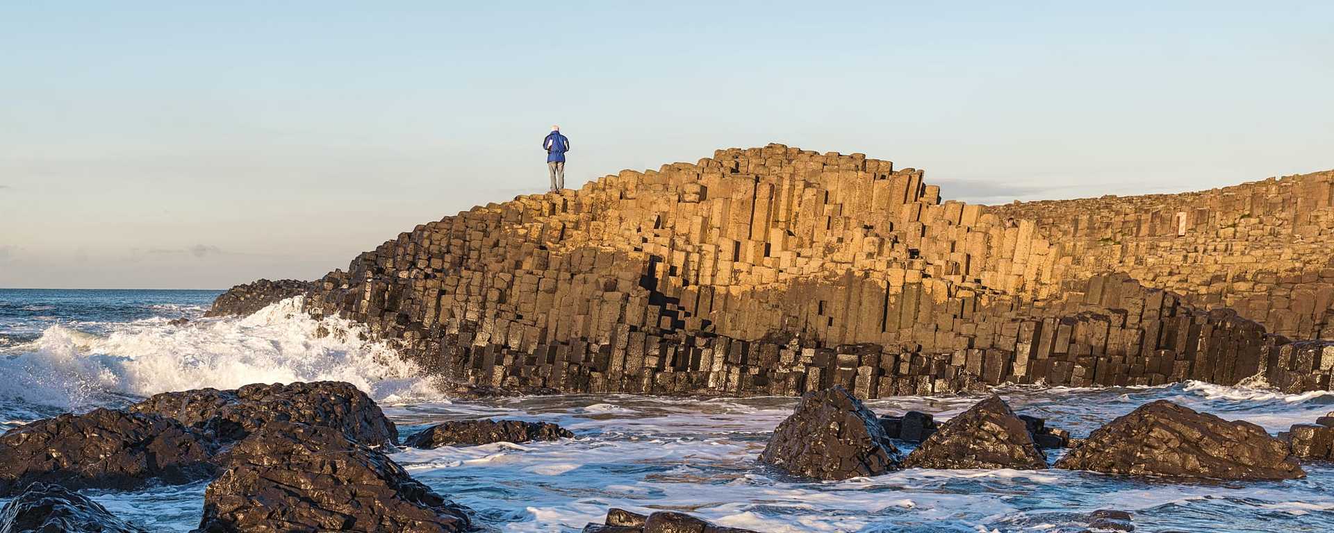 Senior tourist at Giants Causeway in Northern Ireland