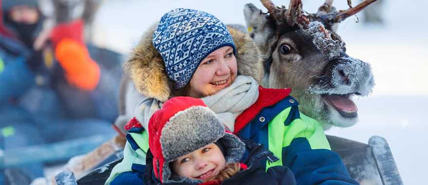 Family on reindeer safari in Finland. Family on reindeer safari in Finland.