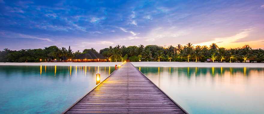 Resort bridge at night in the Maldives