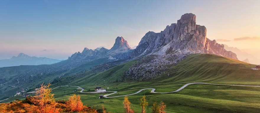 A road winding through the Dolomites. A road winding through the Dolomites.