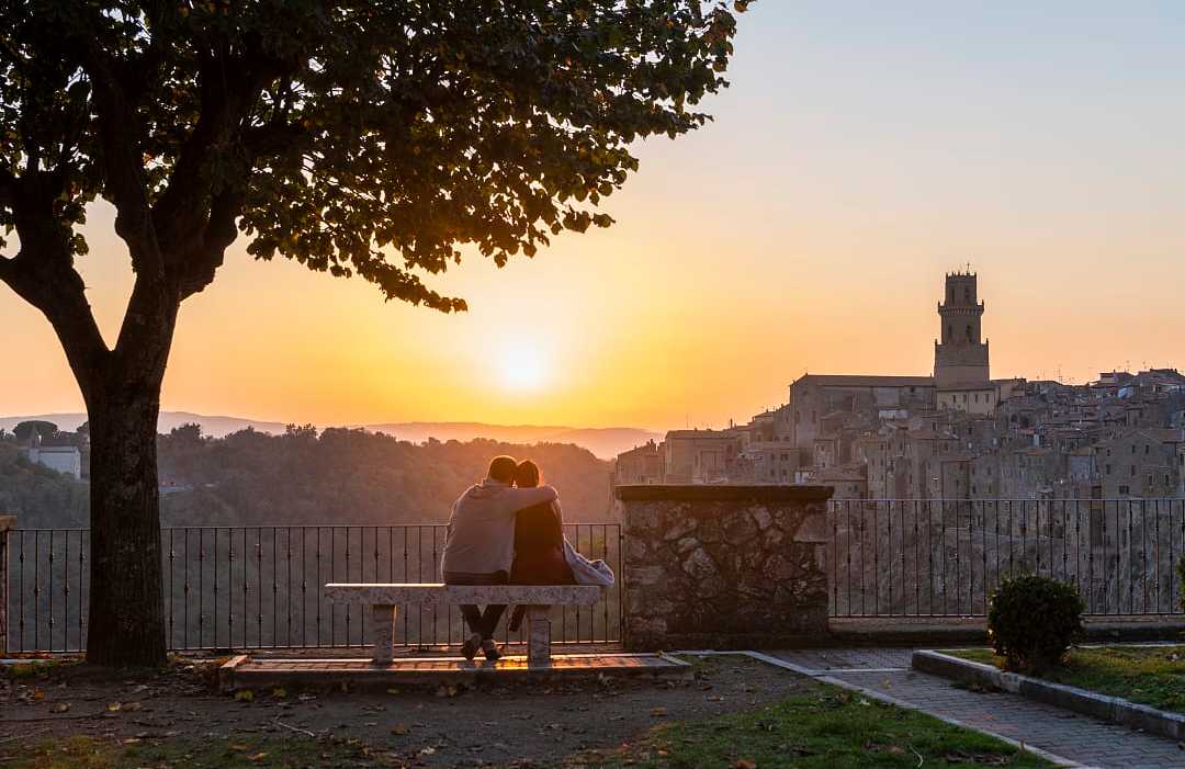Couple in Pitigliano at sunset Tuscany, Italy 