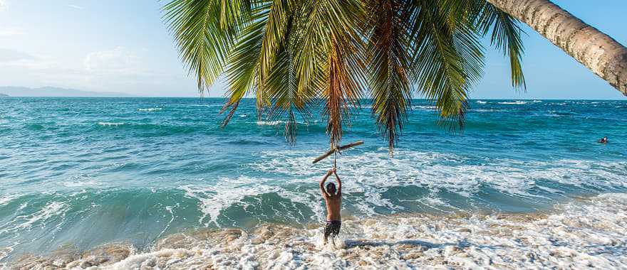 Boy playing on the beach in Costa Rica