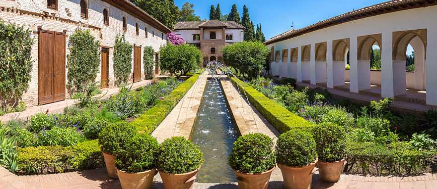 Alhambra Palace in Granada, Spain Garden and bell tower at Alhambra Palace in Granada in a beautiful summer day, Spain