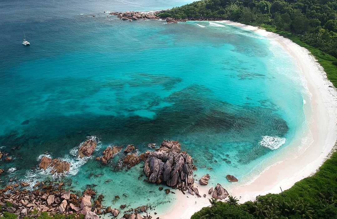 Turquoise waters and iconic granite boulders — paradise found at Anse Lazio, Praslin Island, Seychelles.