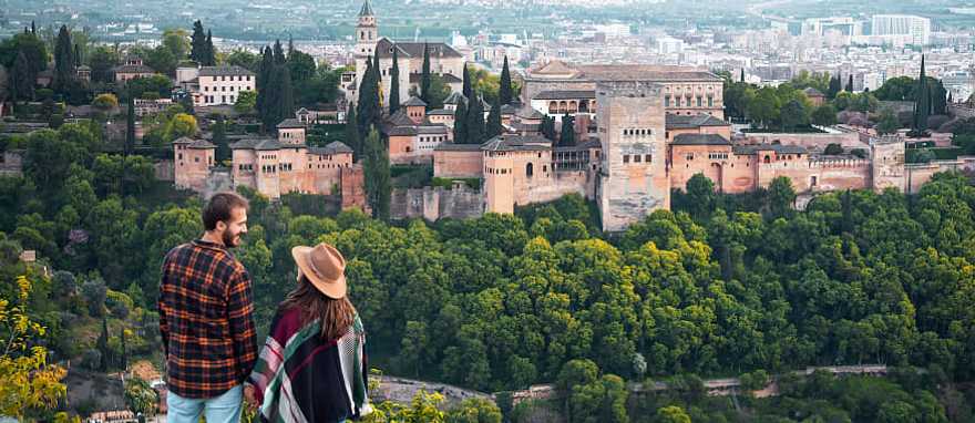 Couple at the Alhambra in Granada, Spain Couple overlooking the Alhambra in Granada, Spain