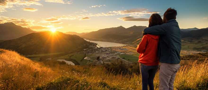 Couple enjoying a sunset in New Zealand 