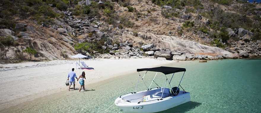Couple on the Beach. Photo Courtesy Lizard Island Couple on secluded beach on Lizard Island, Australia