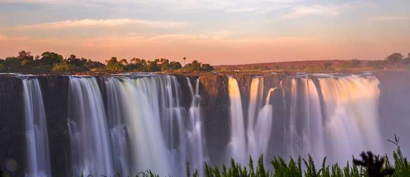 Victoria falls at sunset in Zimbabwe Victoria falls at sunset in Zimbabwe