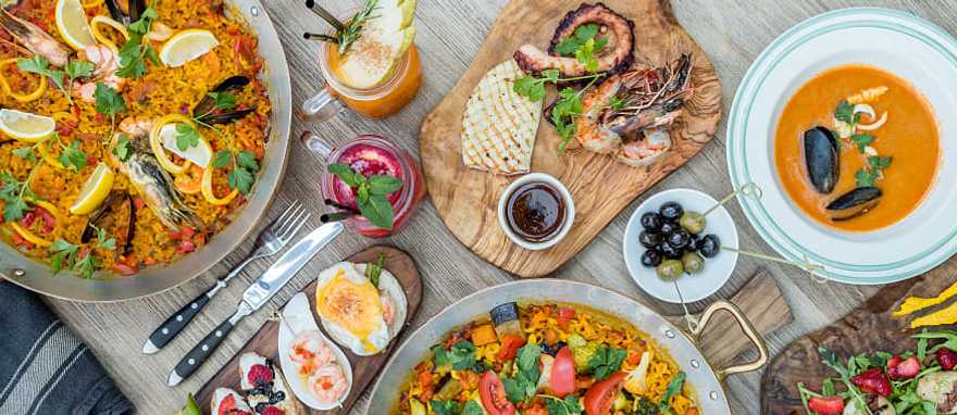 Savor the flavors of homemade food and big city cuisine on this trip to Spain Savor the flavors of homemade food and big city cuisine on this trip to Spain