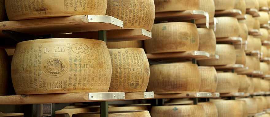 Spectacular Luxury Food Tour of Italy Wheels of parmigiano-reggiano on display in Parma, Italy