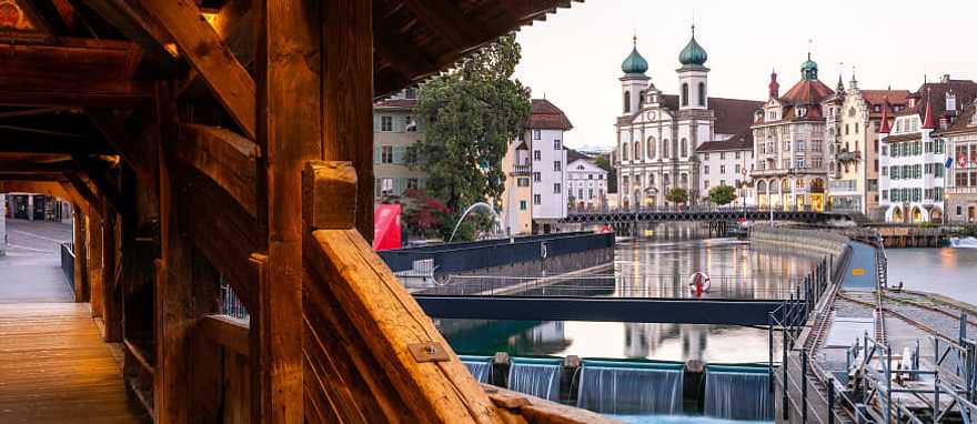 Jesuitenkirche (church right) taken from inside the Spreuerbrücke in Lucerne, Switzerland. Jesuitenkirche (church right) taken from inside the Spreuerbrücke in Lucerne, Switzerland.