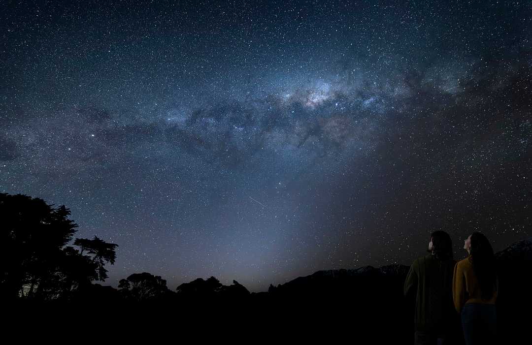 Couple stargazing in New Zealand