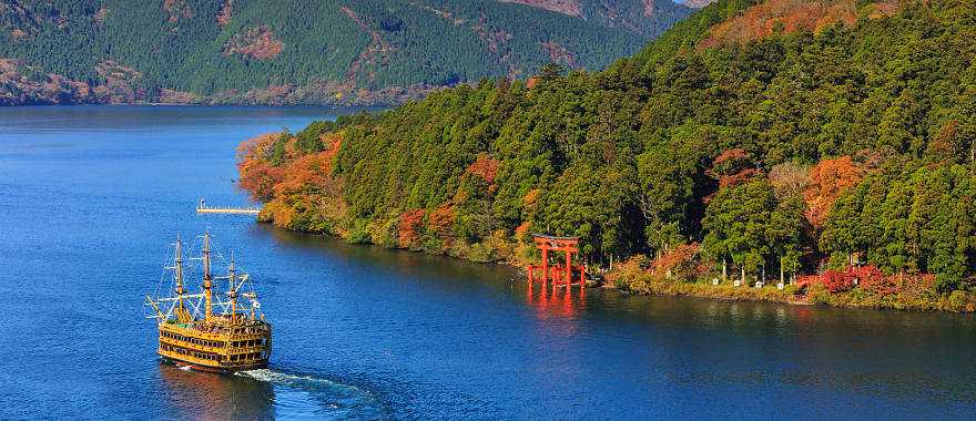 Mt Fuji and Lake Ashi with sightseeing pirate ship in Hakone National Park, Japan.