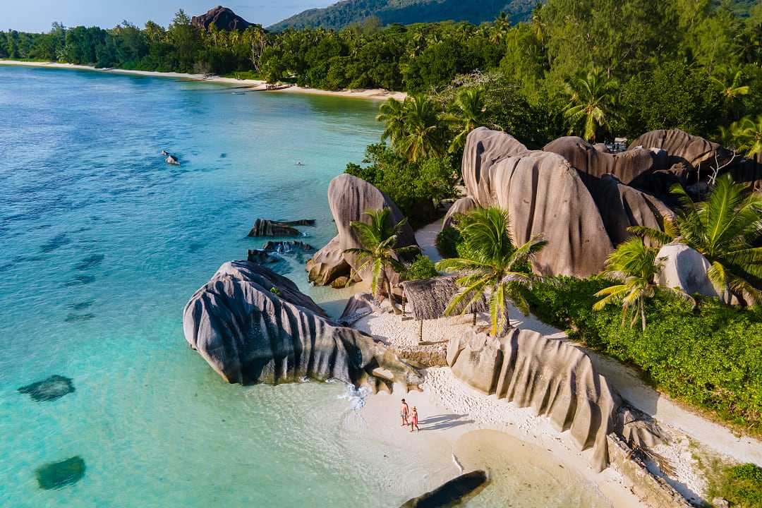 Couple at Anse Source d'Argent Beach on La Digue Island, Seychelles