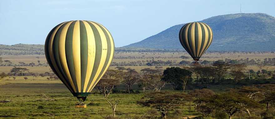 Hot air balloon over Serengeti National Park in Tanzania Hot air balloon over Serengeti National Park in Tanzania