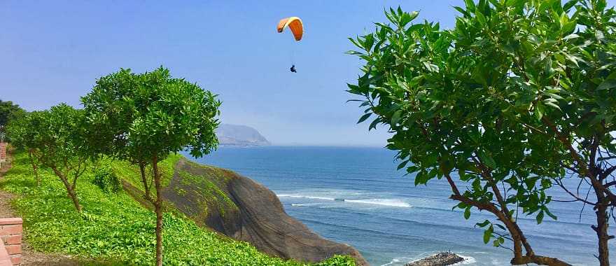 People paragliding in Miraflores, Lima, Peru.