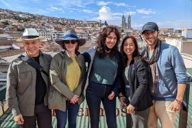 Zicasso staff enjoying a sunny day with city skyline in the background