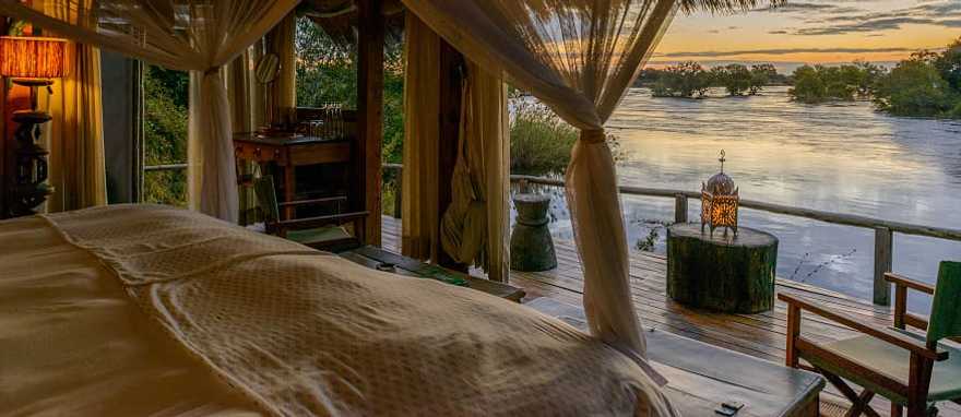 Photo courtesy of Sindabezi Island Camp Sunset view from chalet near Victoria Falls, Zambia. Photo courtesy of Sindabezi Island Camp
