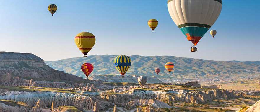 Hot air balloon floating above Cappadocia, Turkey.