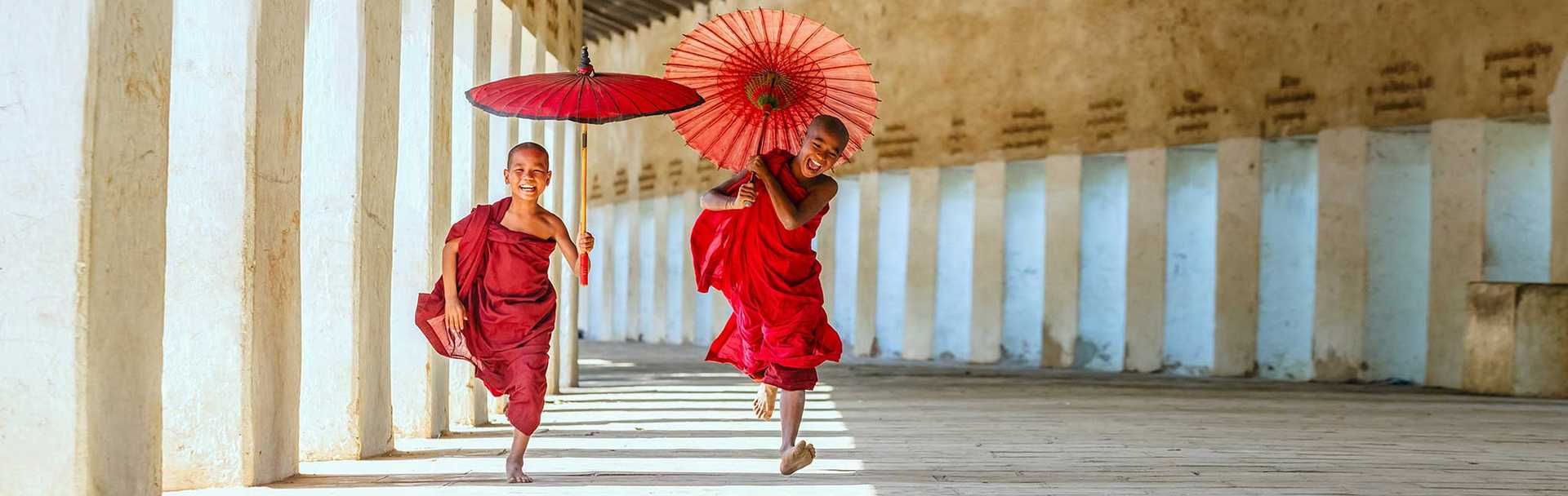 Myanmar Tour - Young monks running at temple in Bagan