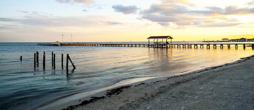 San Pedro beach at sunset in Ambergris Caye, Belize San Pedro beach at sunset in Ambergris Caye, Belize