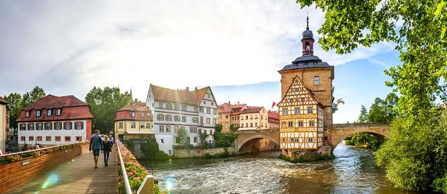 Couple walking across a bridge in Bamberg, Germany.