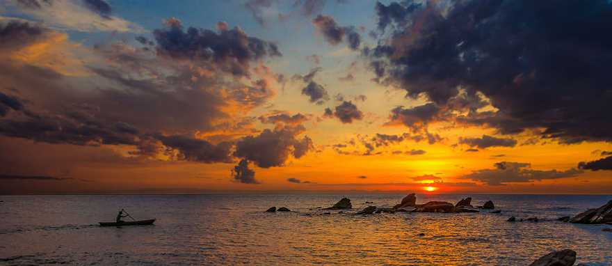 Canoeing Lake Malawi at sunset