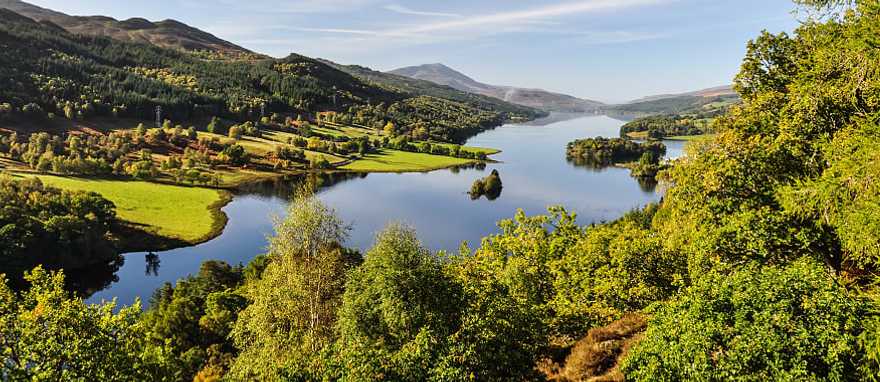 Beautiful summer view across Loch Tummel seen from Queen's View, located near Pitlochry, Perthshire, Scotland, UK. Beautiful summer view across Loch Tummel seen from Queen's View, located near Pitlochry, Perthshire, Scotland, UK.