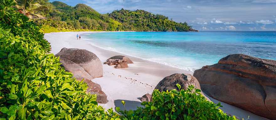 Couple on beautiful Anse Intendance beach on Mahe island, Seychelles Couple on beautiful Anse Intendance beach on Mahe island, Seychelles