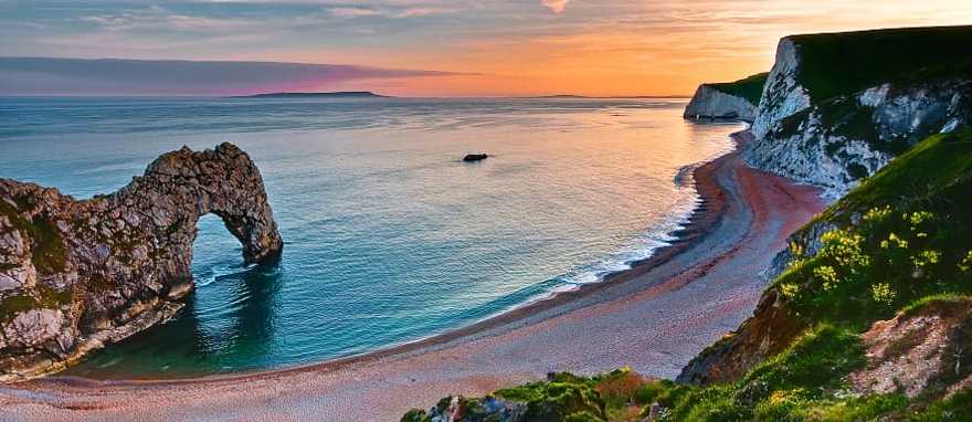 Sunset over Durdle Door on England's Jurassic Coast Sunset over Durdle Door on England's Jurassic Coast