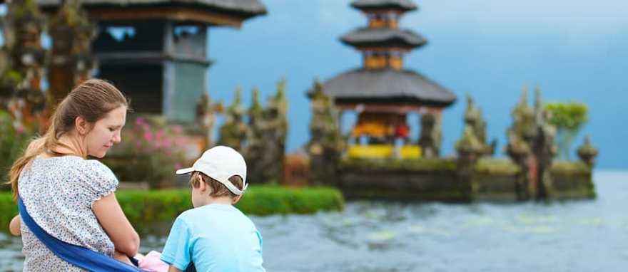 Mother and kids at Bratan Water Temple in Bali, Indonesia Mother and kids at Bratan Water Temple in Bali, Indonesia