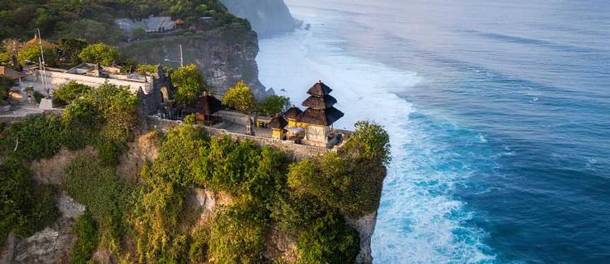 Cliffside Pura Luhur Uluwatu Temple at sunrise in Bali, Indonesia Cliffside Pura Luhur Uluwatu Temple at sunrise in Bali, Indonesia